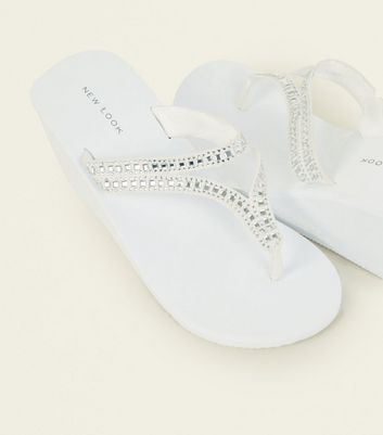 white embellished flip flops