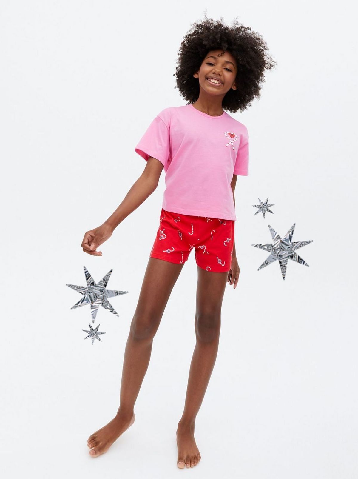 Girl wearing a black and pink pyjama set