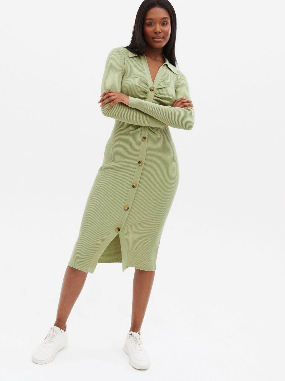 Woman wearing a green button front collared midi dress