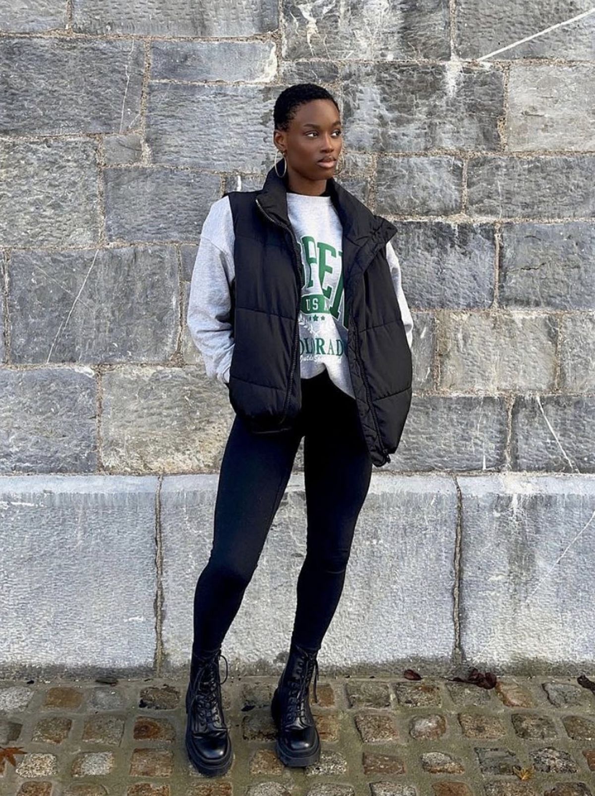 New Look's Temi wearing a sleeveless puffer jacket and black leggings
