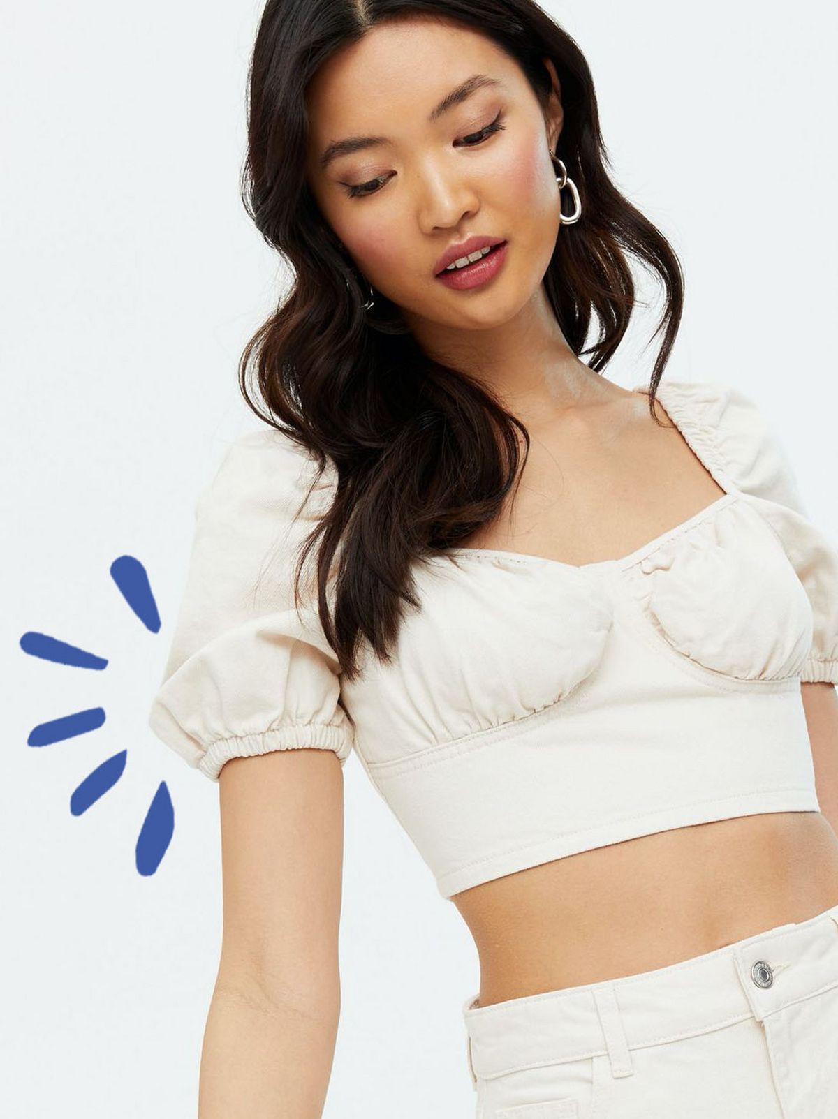 Woman wearing a denim bustier crop top
