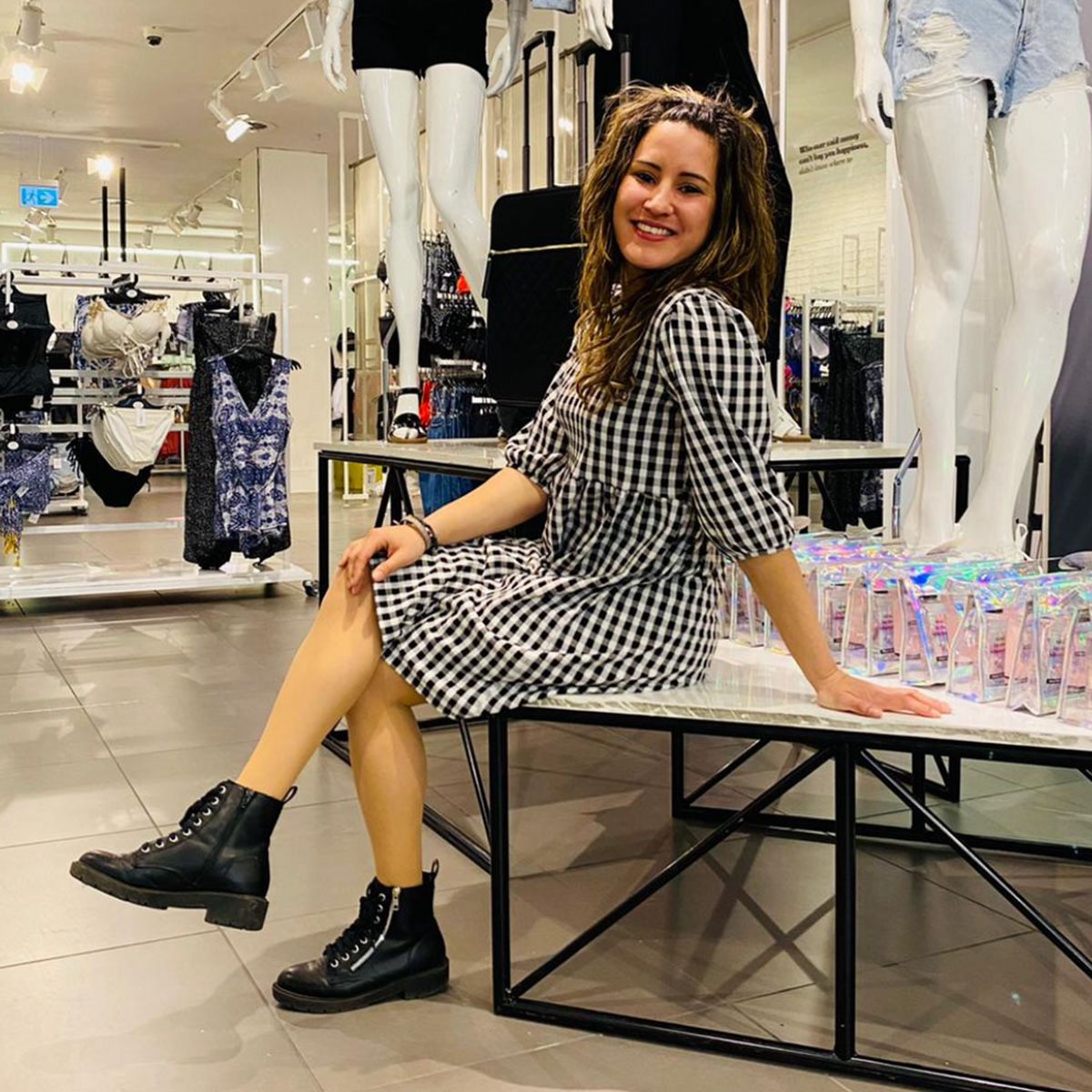 Angels, Supervisor at New Look Westfield wearing a black and white checked dress and black boots
