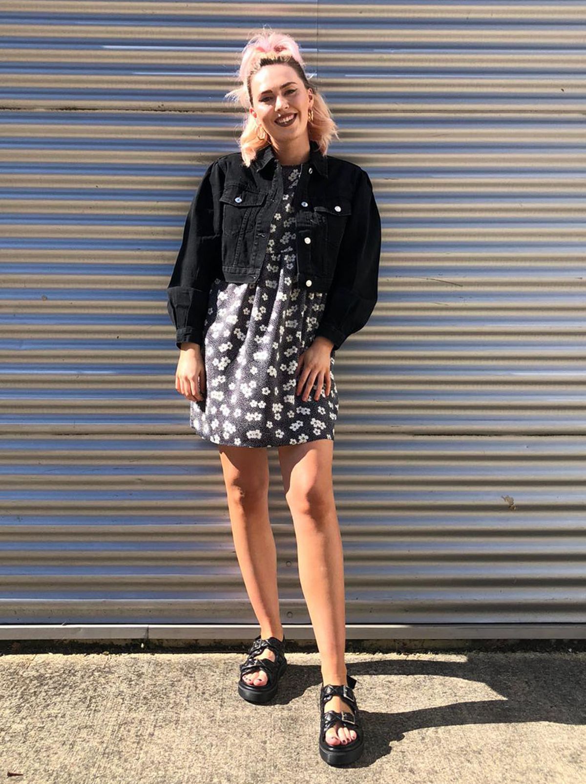 Liv Simpson Deputy Manager at New Look Swindon wearing a floral dress, black denim jacket and black chunky sandals