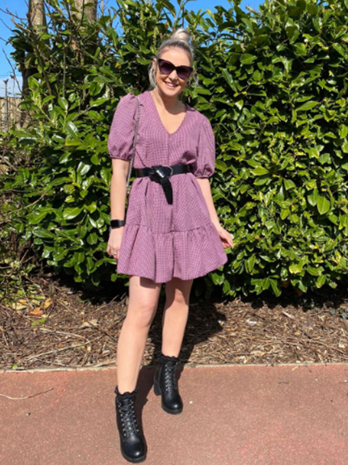 Leanne Howarth Store Manager at New Look Deepdale wearing a purple gingham dress, sunglasses, lack belt and black boots