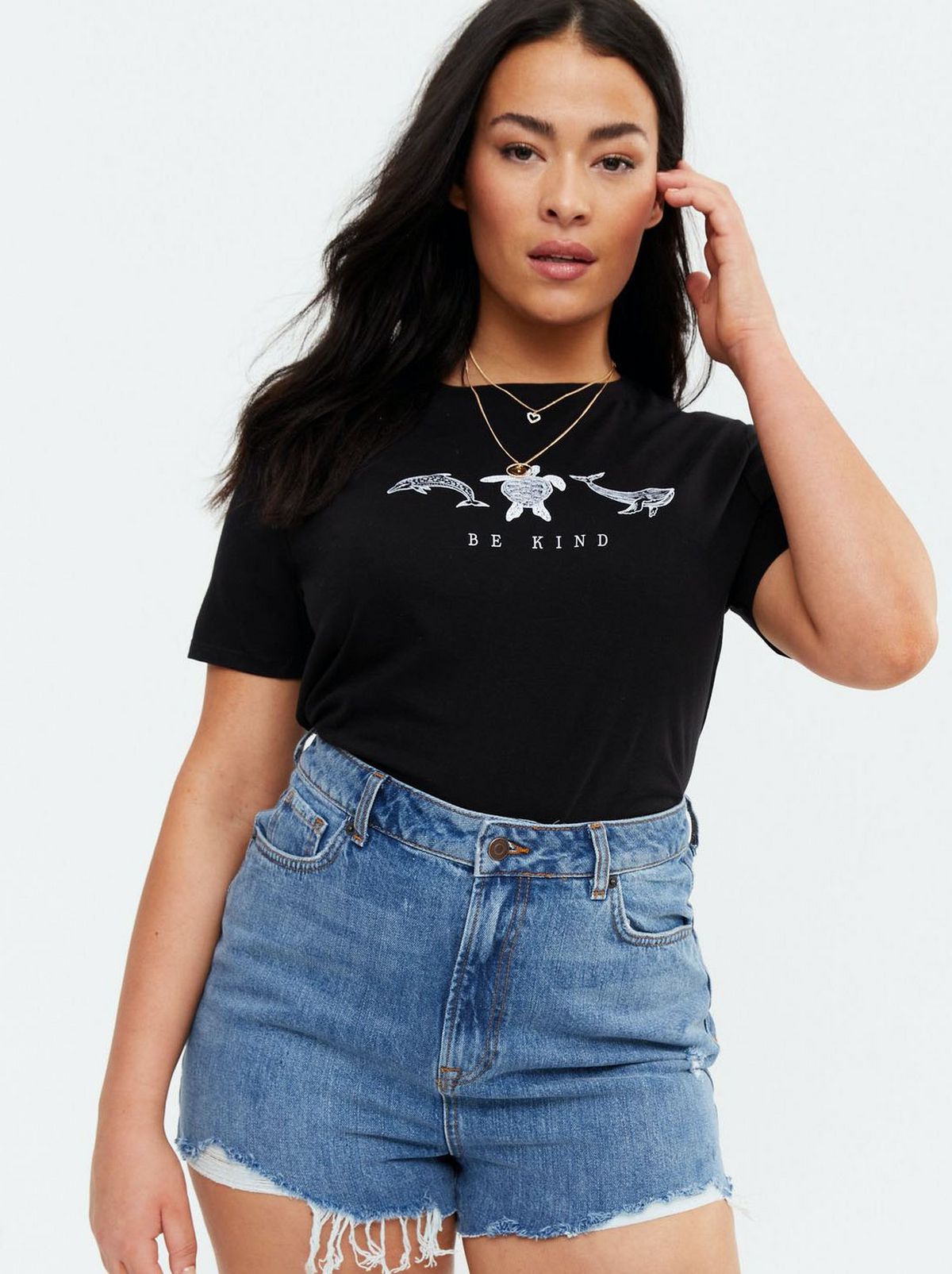 Woman wearing a black slogan tee