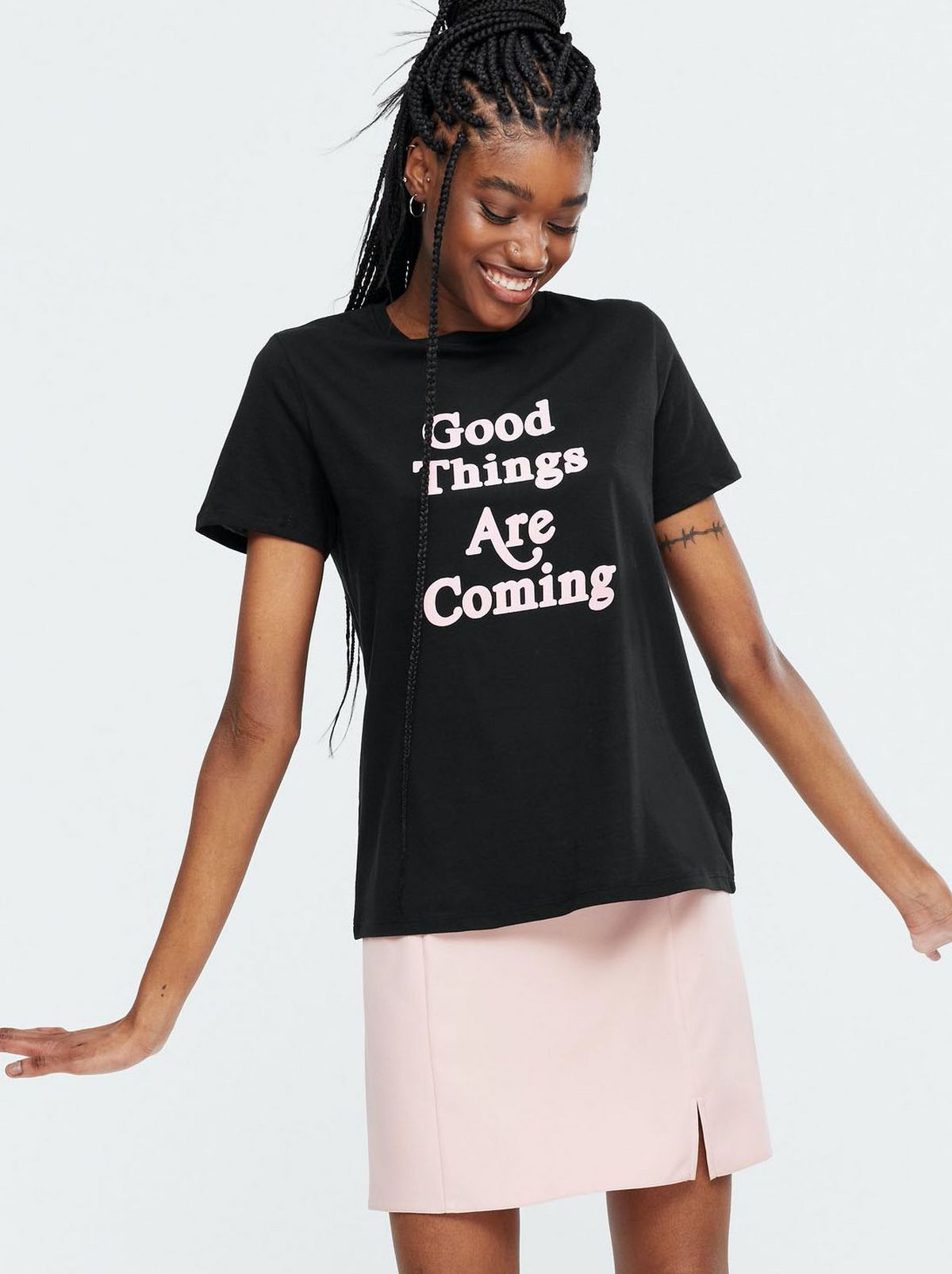 Woman wearing a black slogan t-shirt