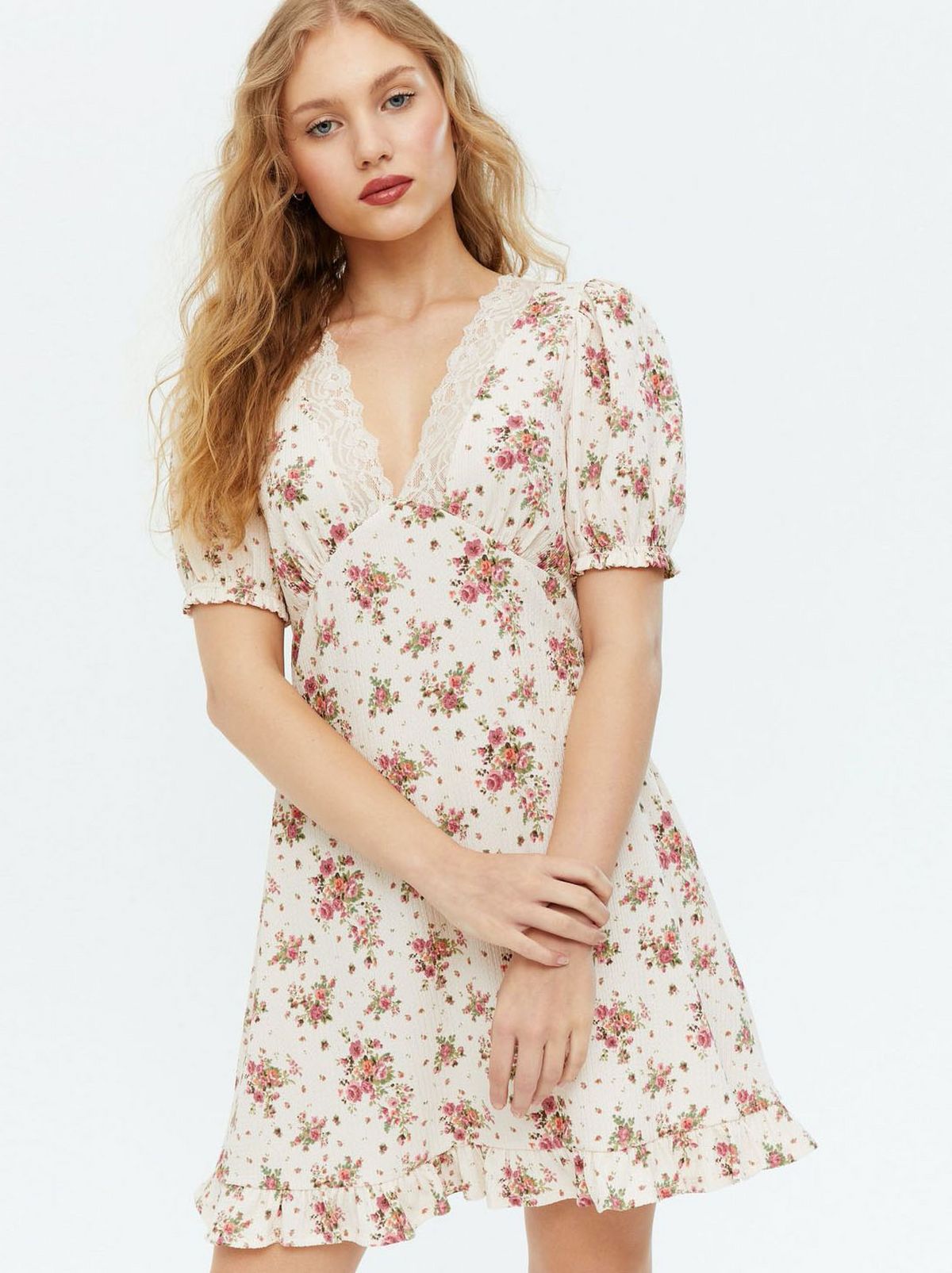 Woman wearing a floral lace frill mini dress
