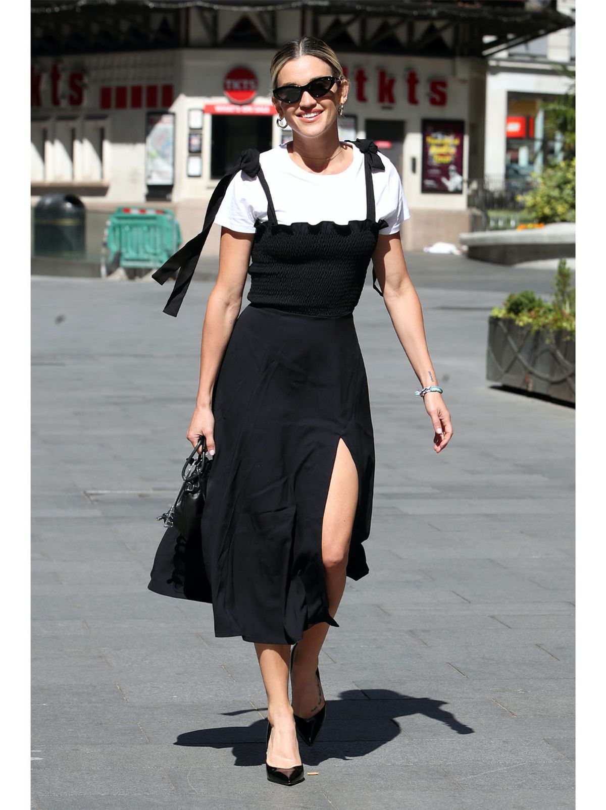 Ashley Roberts wearing a black midi dress with a white t-shirt