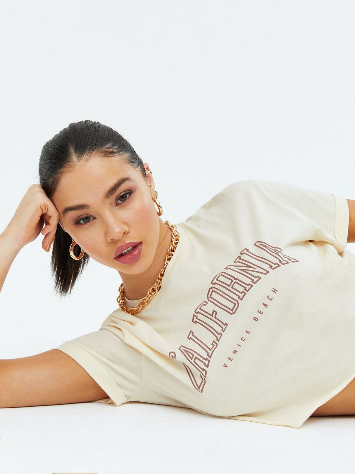 Woman wearing a California varsity logo t-shirt
