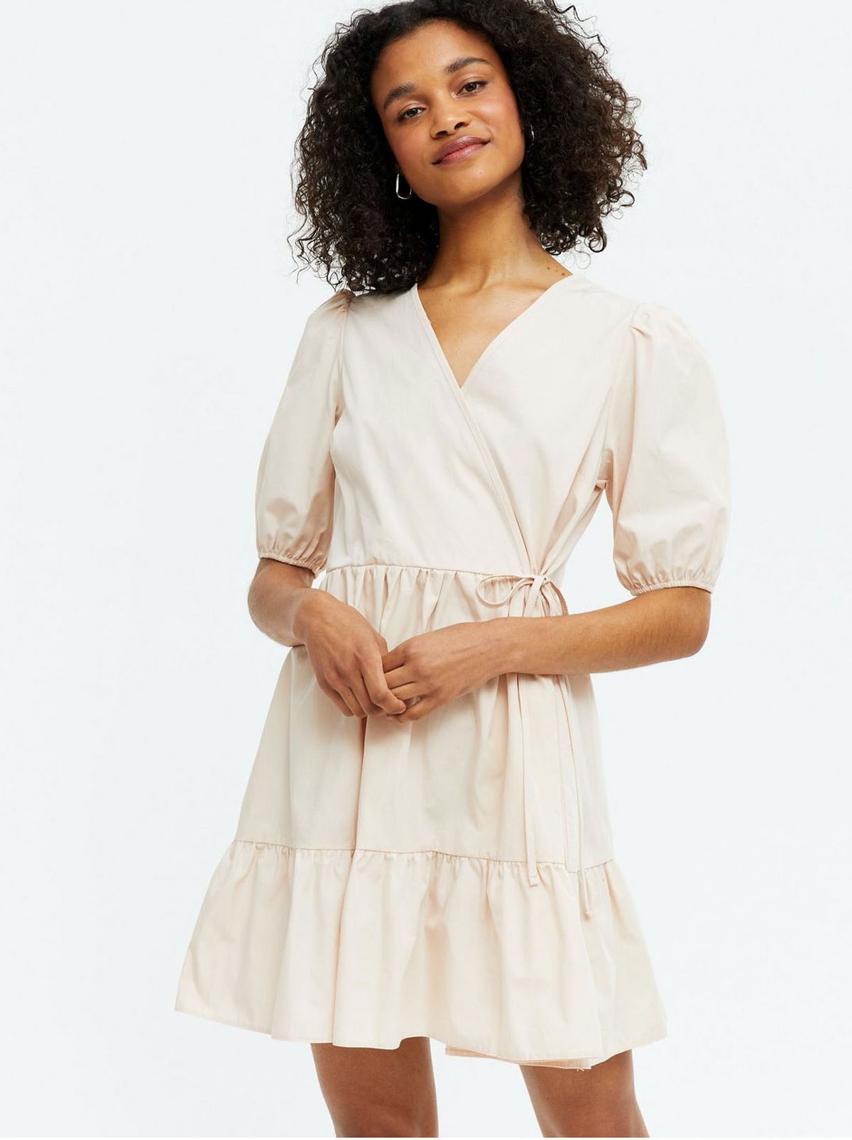 Woman wearing a camel washed wrap smock dress