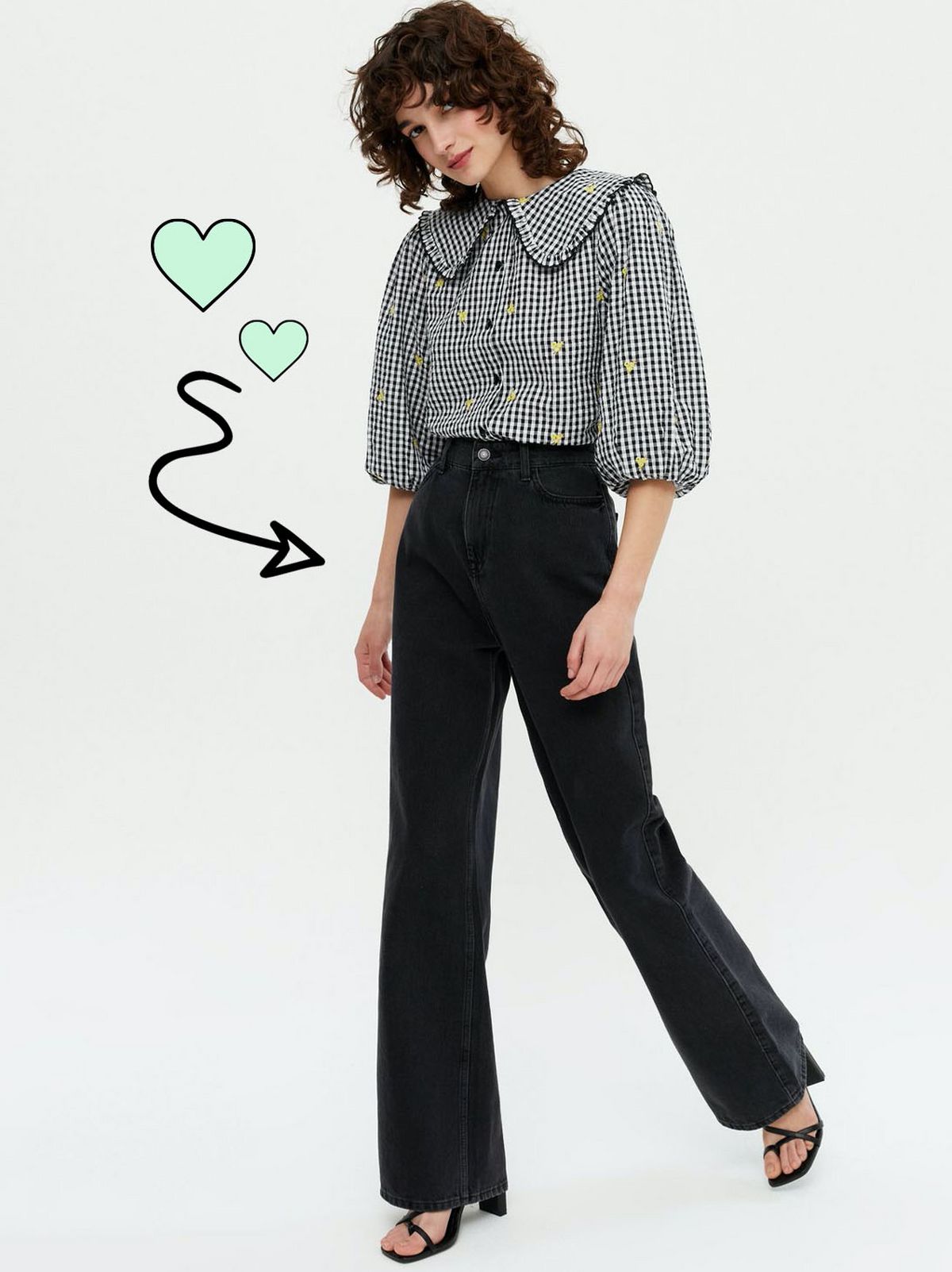 Woman wearing a black gingham frill collar shirt, black trousers and heels