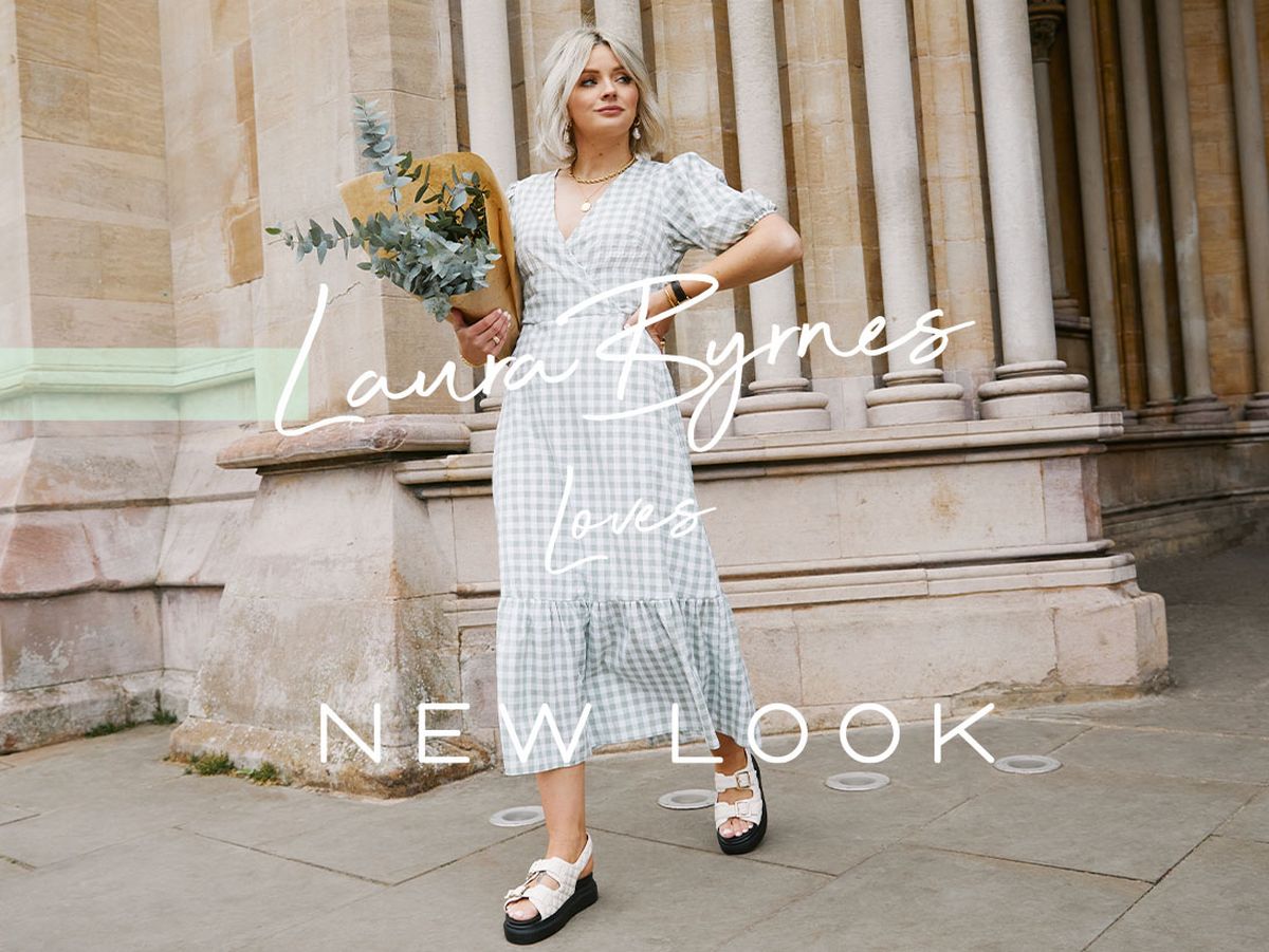 Laura B wearing a green gingham midi dress and white platform sandals