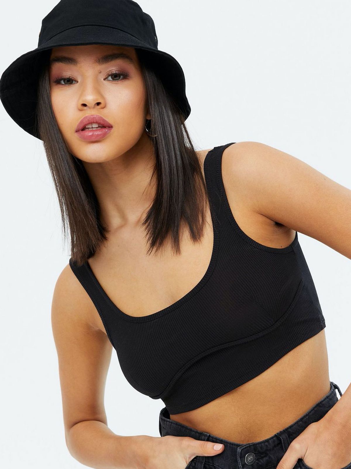 WomanWearingABlackBucketHat
