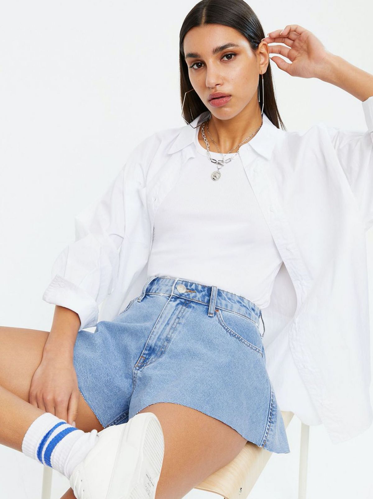 Woman Wearing Blue Denim Cut Off Shorts
