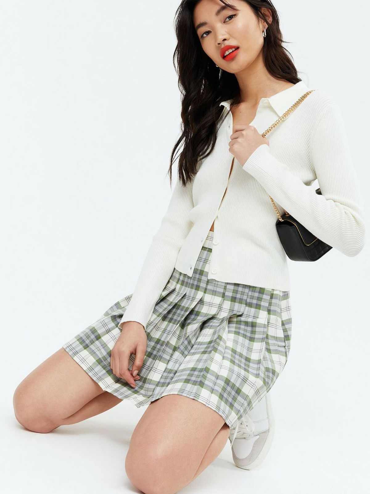 Woman Wearing A Green Check Pleated Mini Tennis Skirt