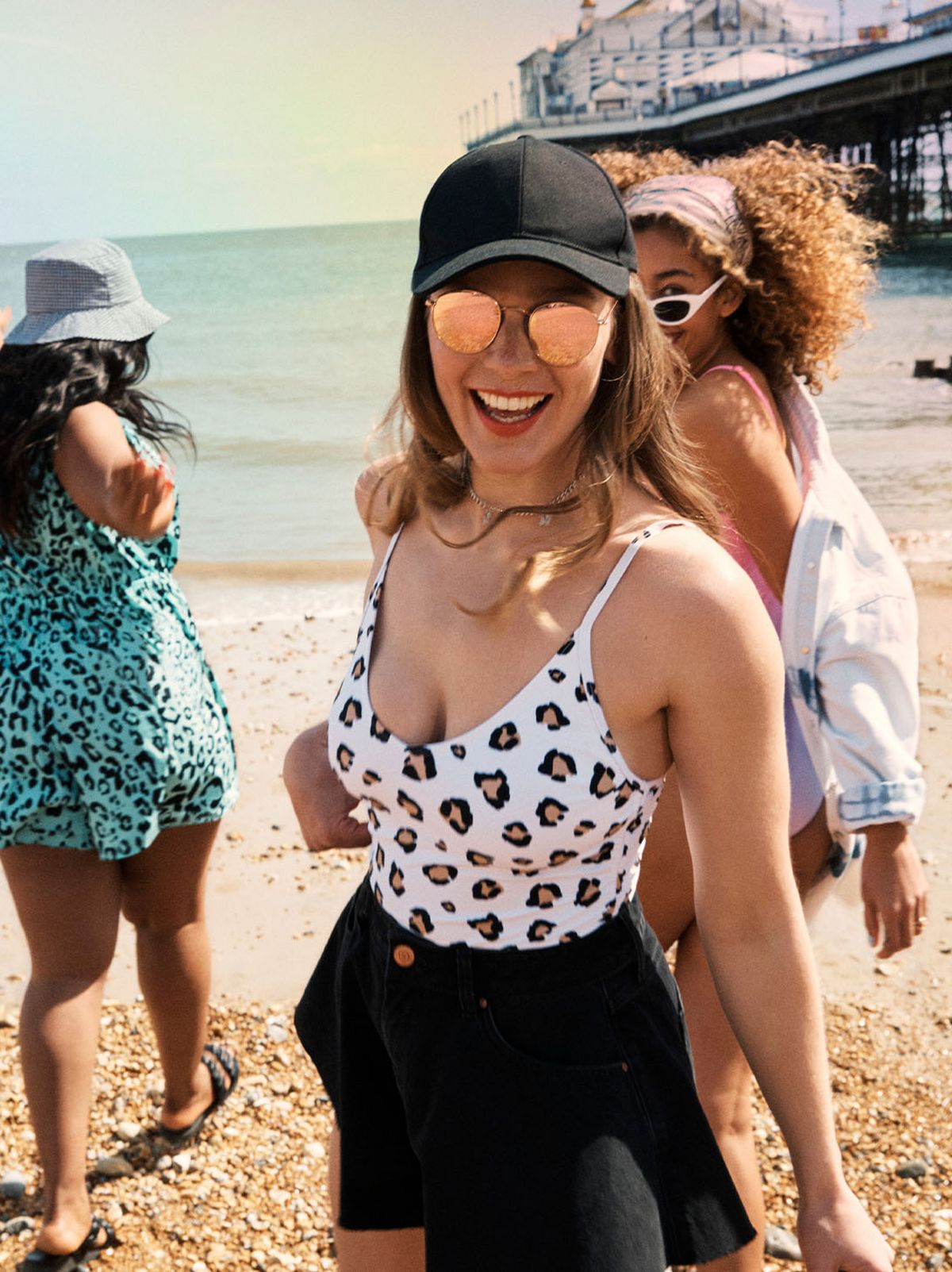 Women wearing swimming costumes on the beach