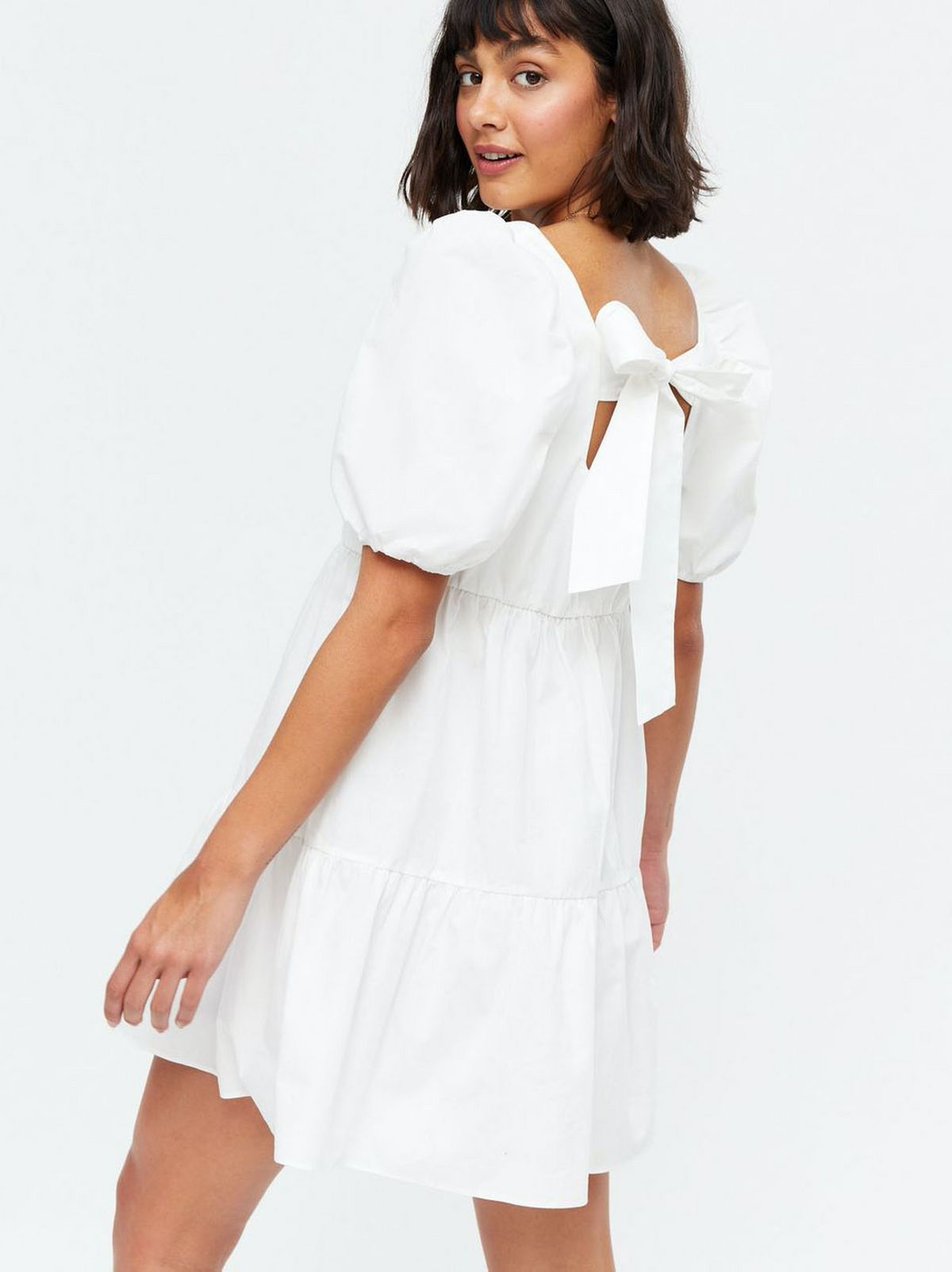 Woman wearing a White Poplin Square Neck Tie Back Dress