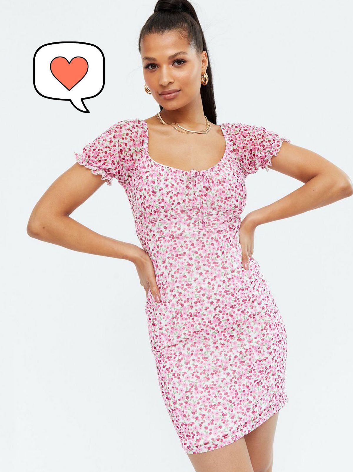 Woman wearing a pink floral mesh bodycon mini dress