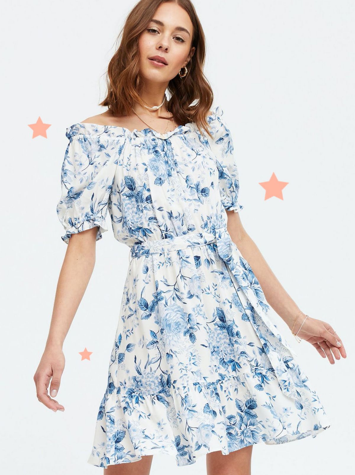 Woman wearing a blue flora bardot belted dress