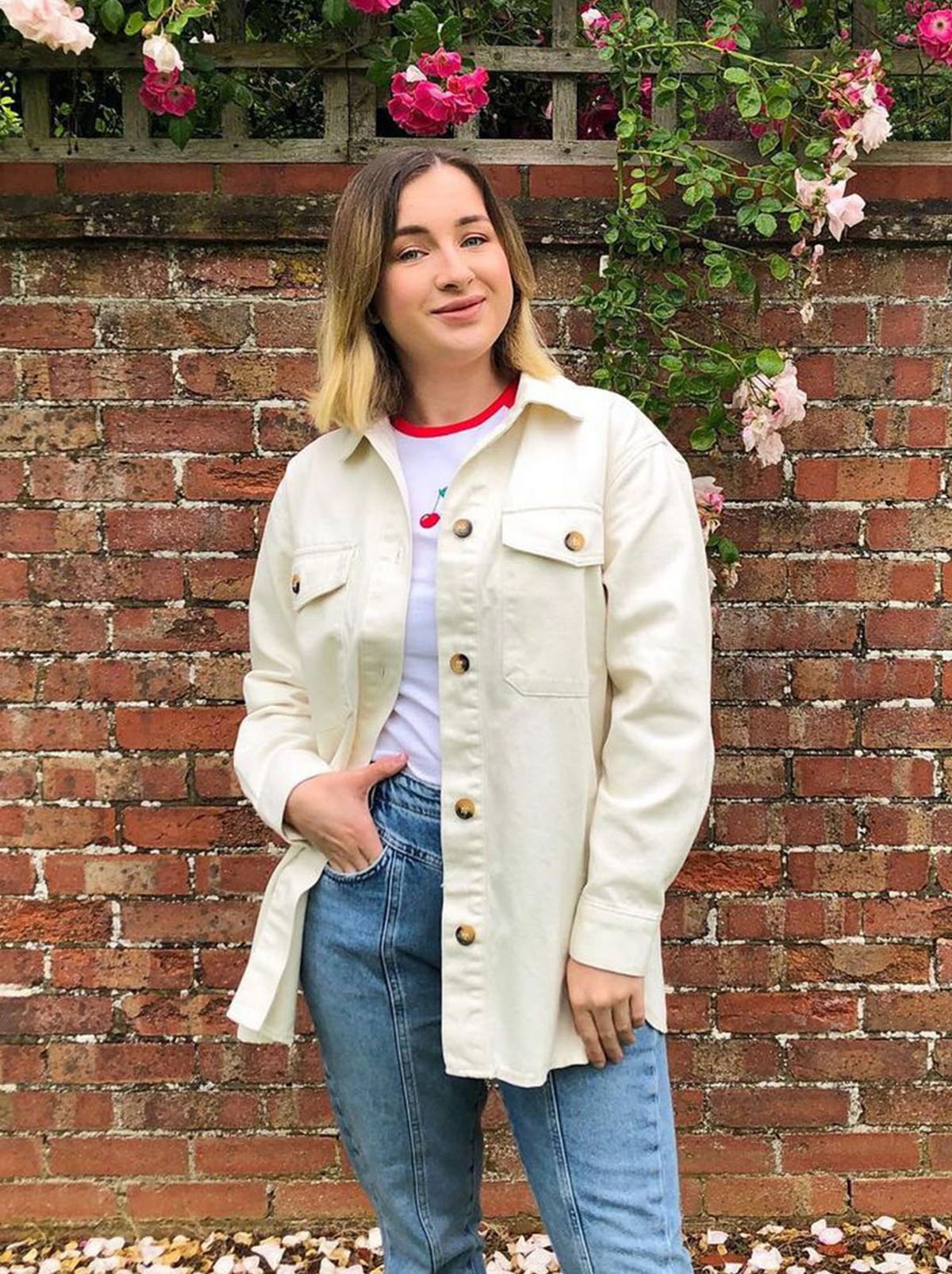 New Look's Charlotte wearing a cram jacket, white top and jeans