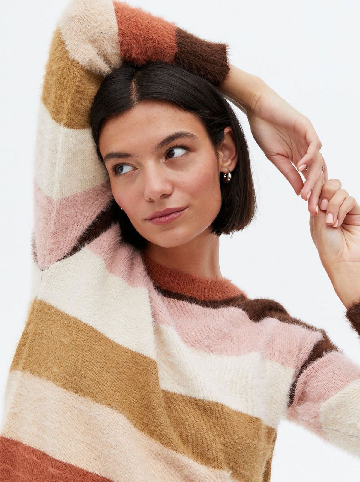Woman wearing a brown stripe fluffy knit jumper