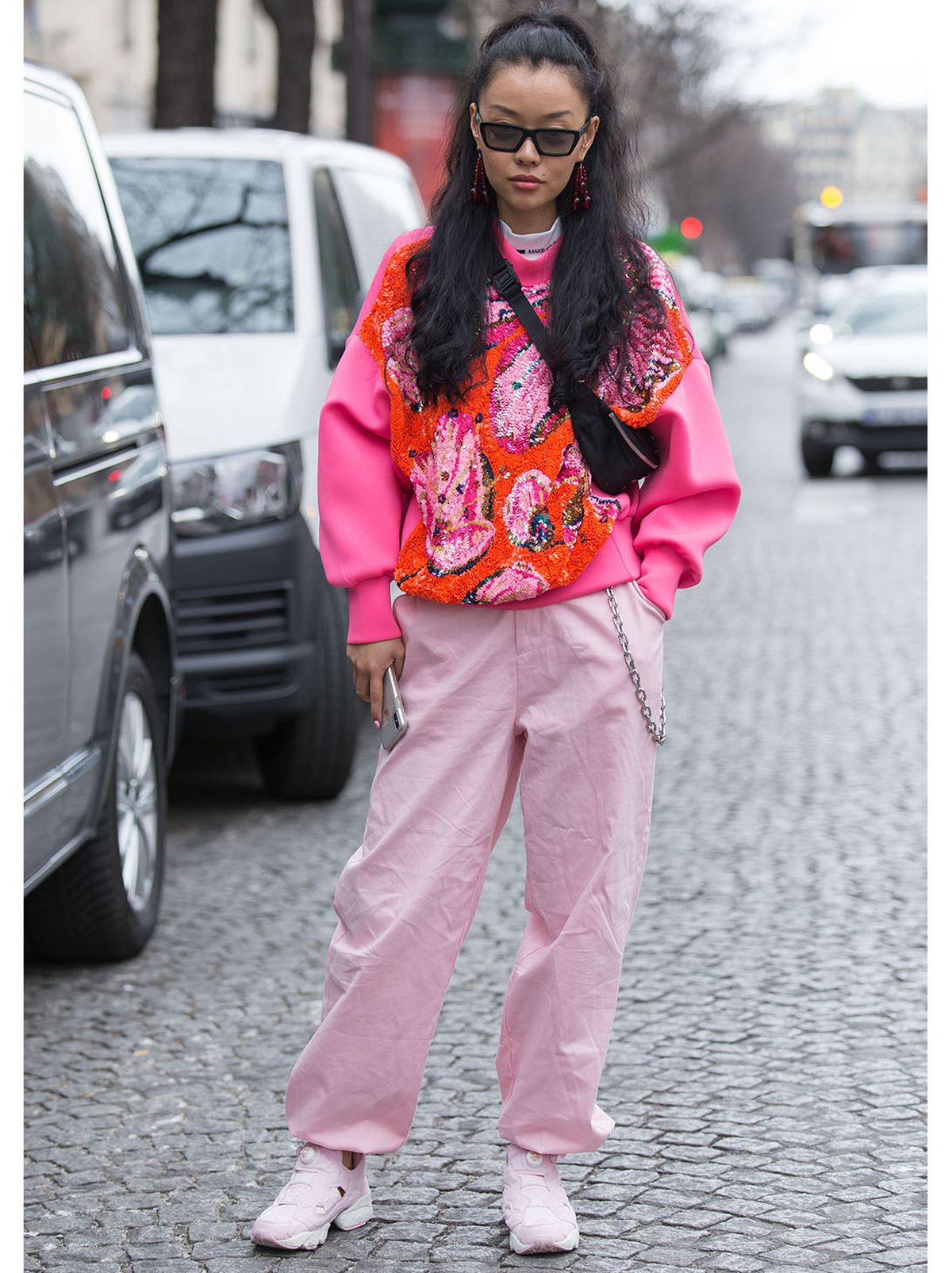 Woman wearing a pink embellished knitted jumper