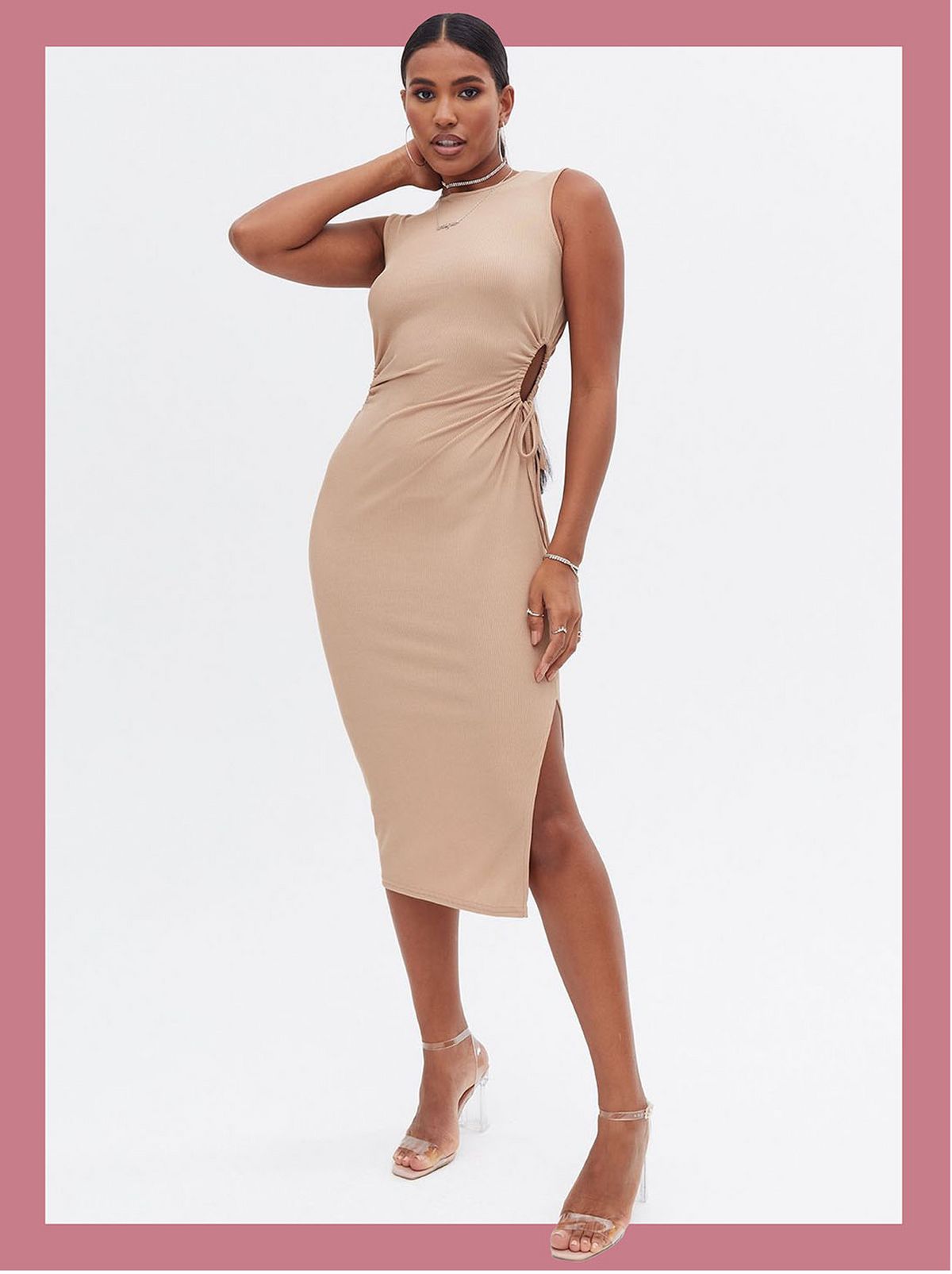 Woman wearing a camel ribbed cut out bodycon midi dress and heels