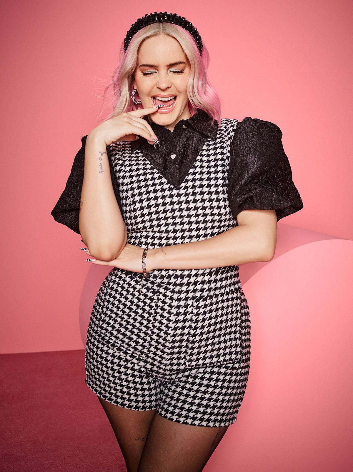 Anne Marie wearing a New Look playsuit and puff sleeve top	