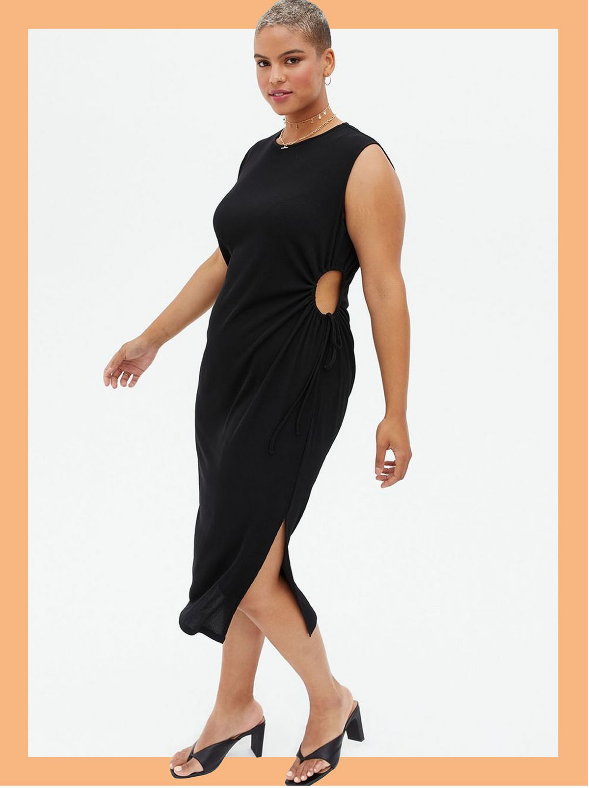 Woman wearing a black ribbed cut out bodycon midi dress