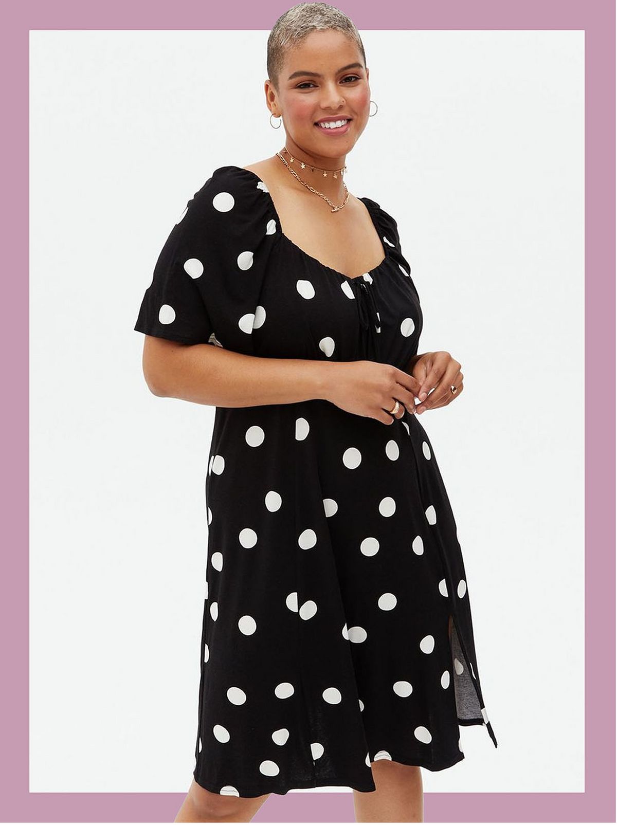 Woman wearing a black spot square neck tie front dress