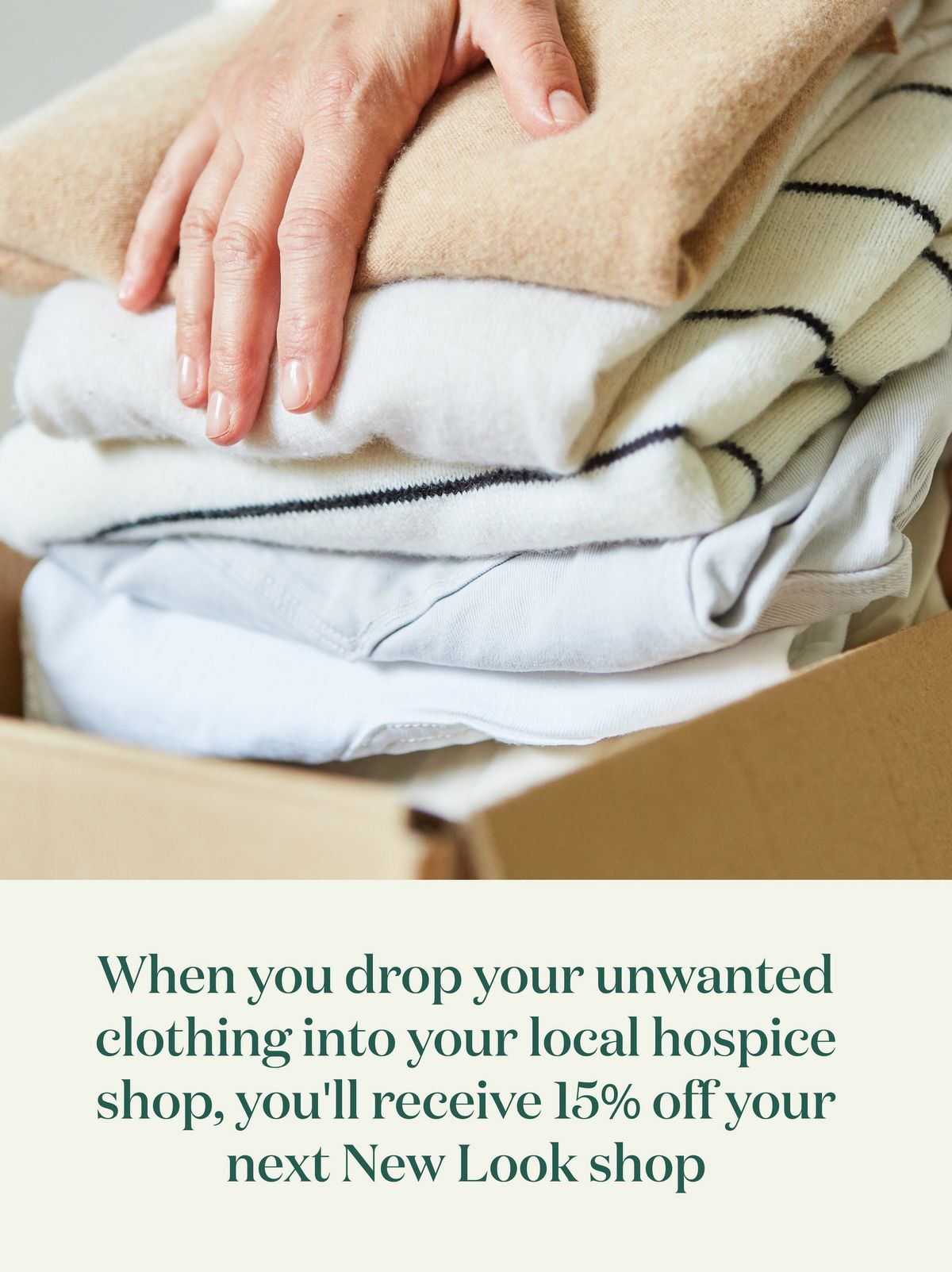 Packing unwanted clothes into donation boxes