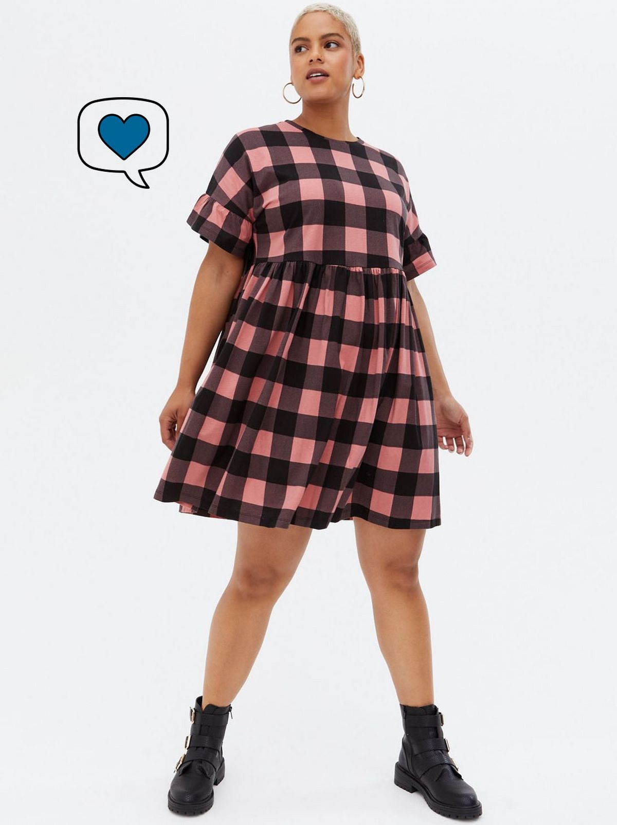 Woman wearing a red check jersey mini dress