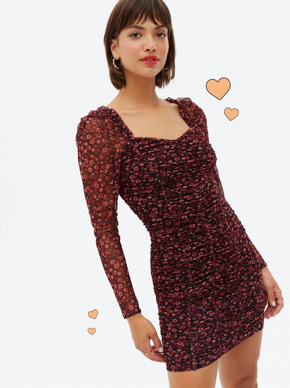 Woman wearing a ditsy floral puff sleeve bodycon dress