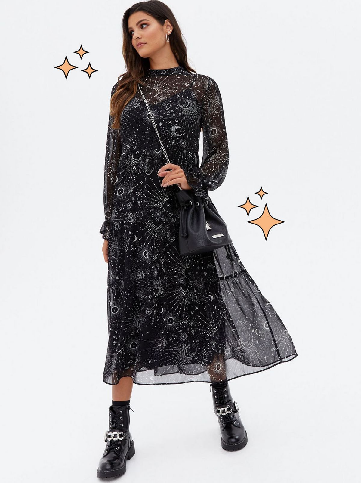 Woman wearing a black mystic long sleeve midi smock dress and boots
