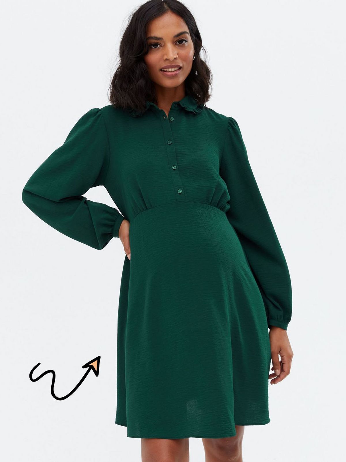 Woman wearing a green button front mini shirt dress