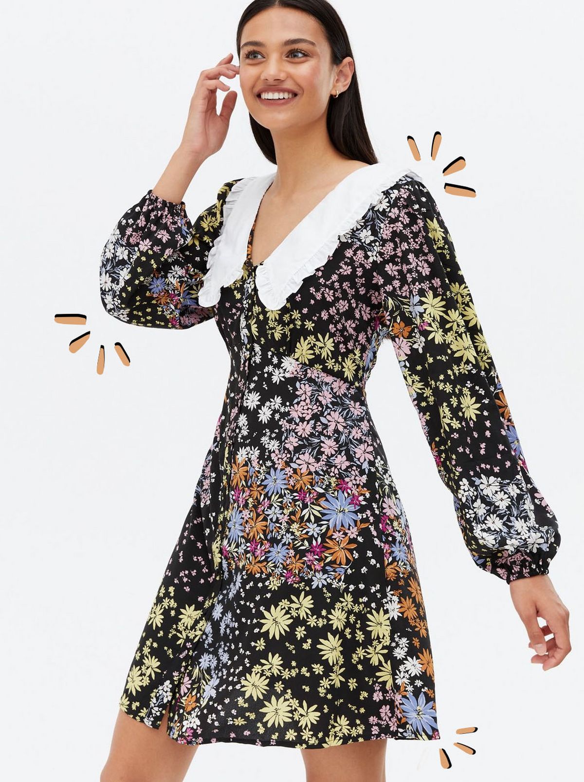 Woman wearing a black ditsy floral mini dress