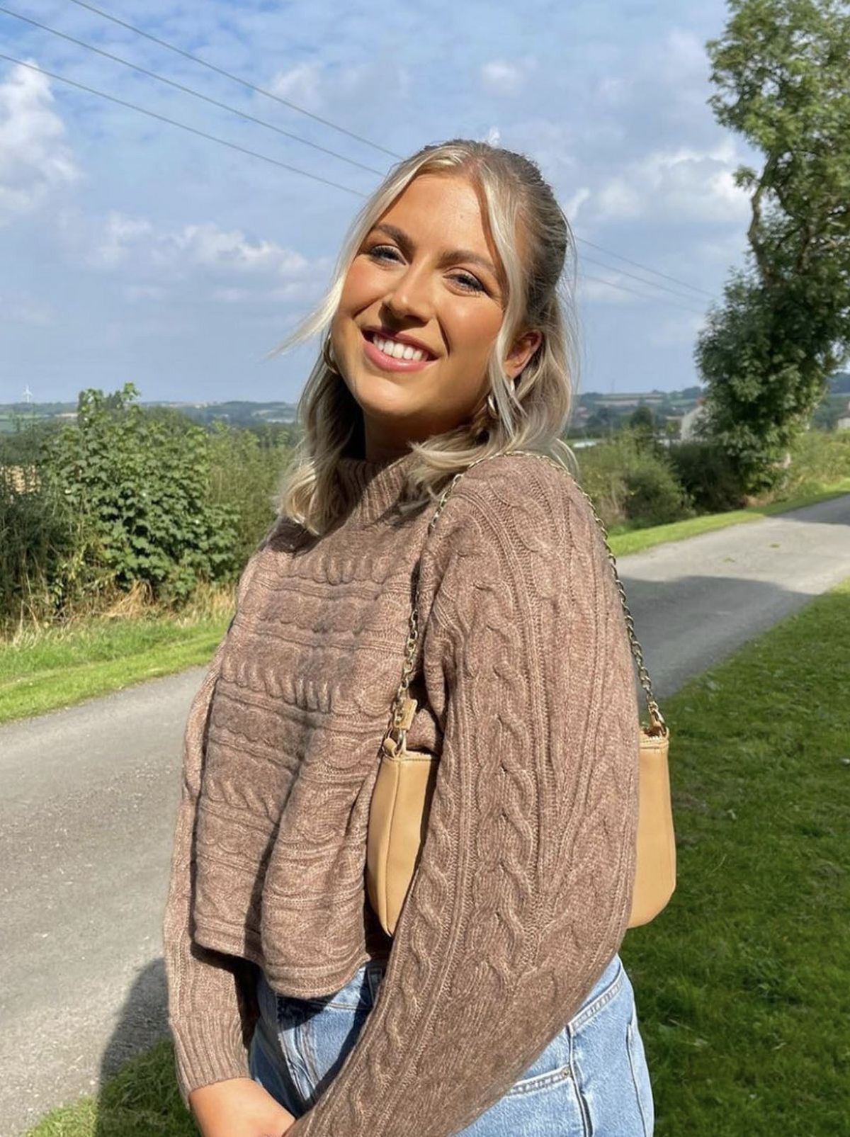 New Look's Lauren wearing a mink cable knit crop jumper