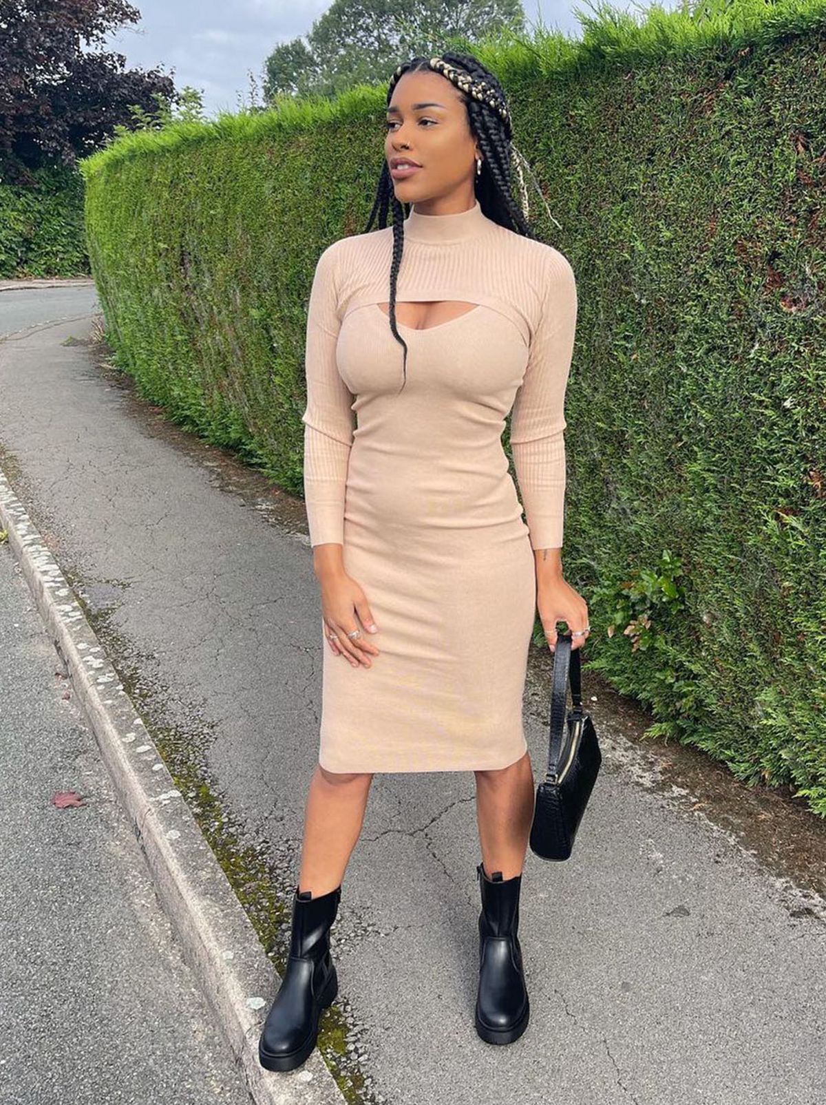 New Look's Jasmine wearing a camel knit high neck midi bodycon dress