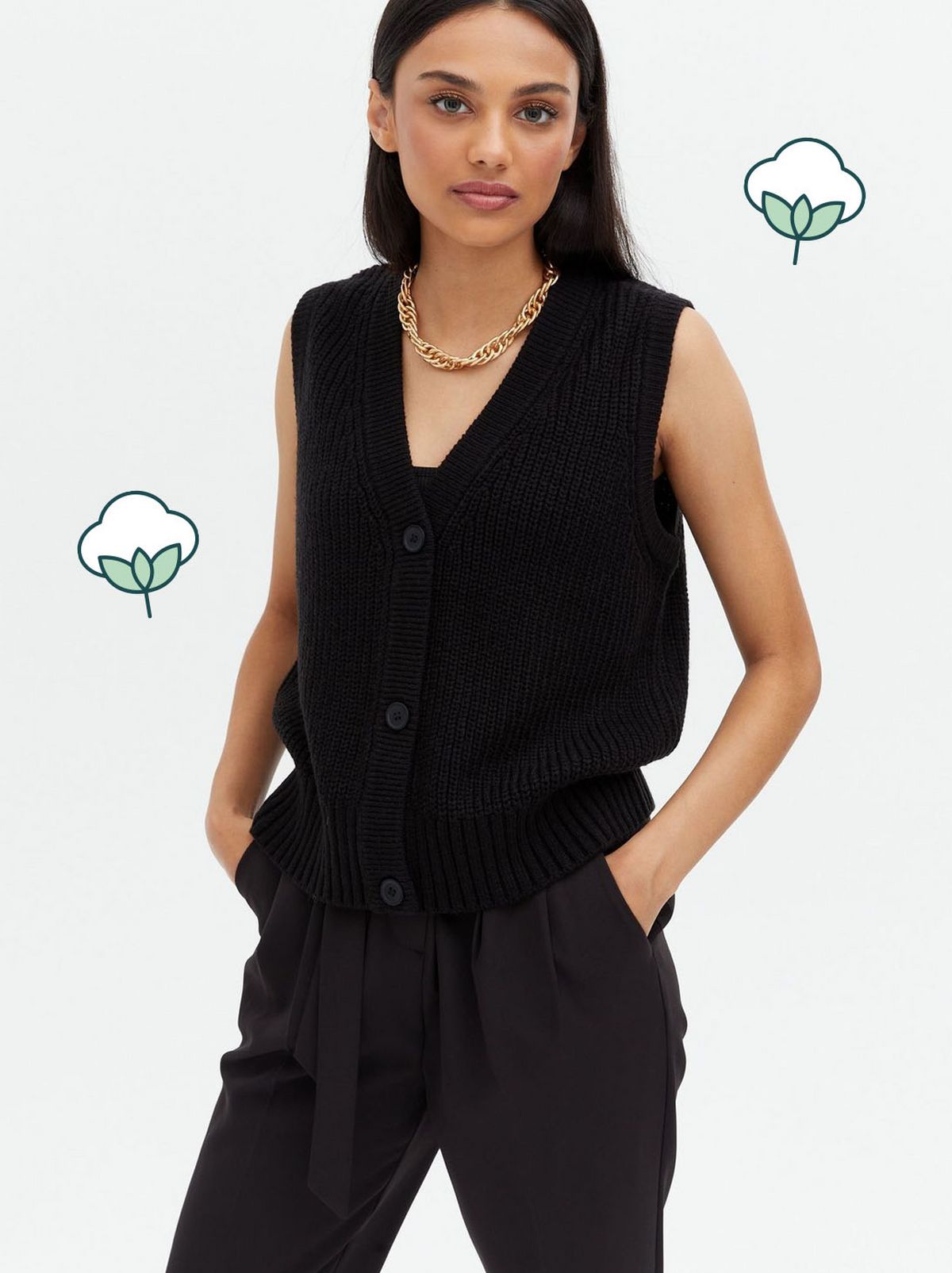 Woman wearing a black ribbed knit sleeveless vest and trousers