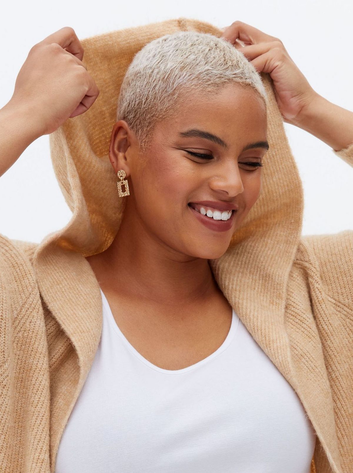 Woman wearing a long hooded cardigan