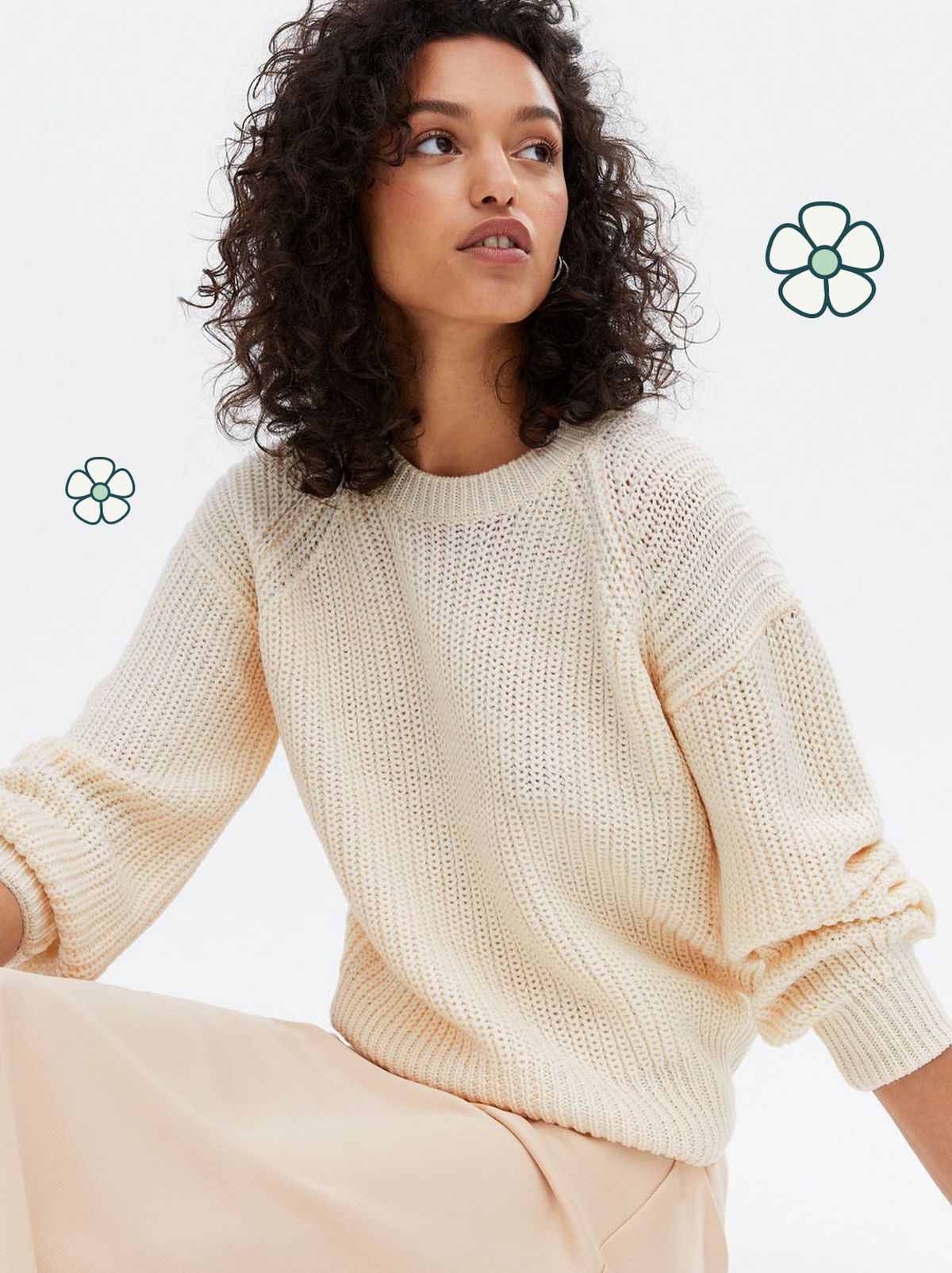 Woman wearing a off white crew neck jumper