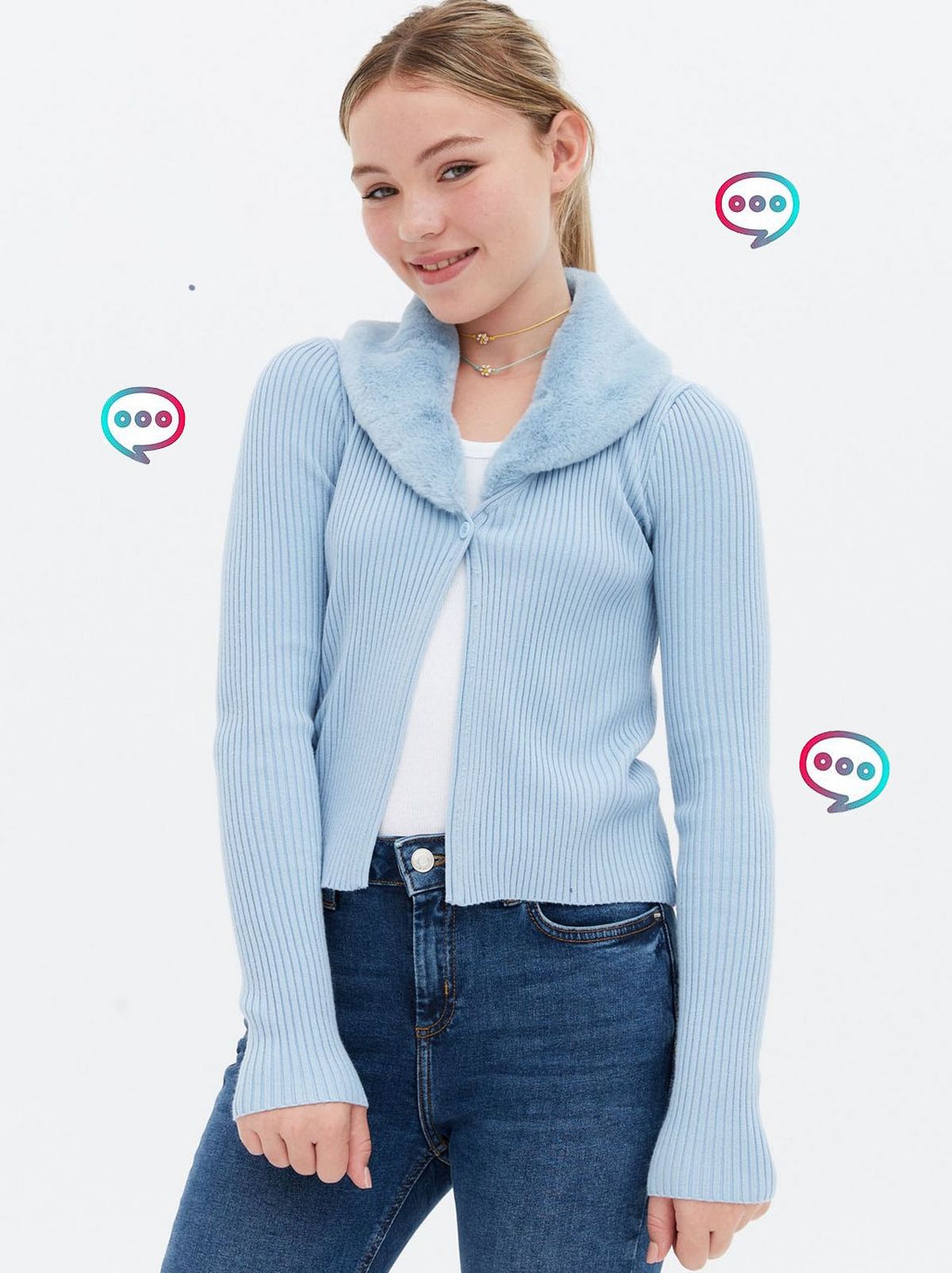 Girl wearing a pale blue faux fur collar cardigan, top and jeans	