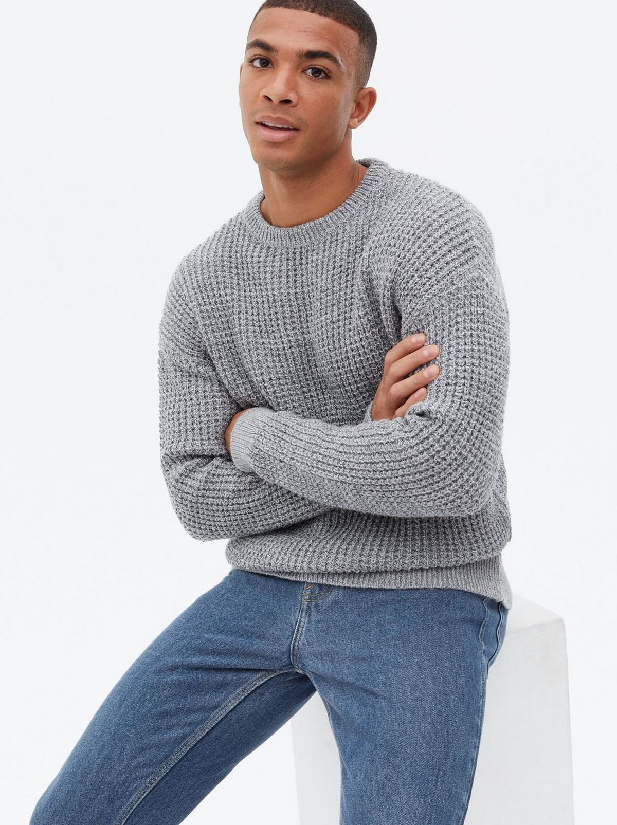 Man wearing a grey stitch crew jumper