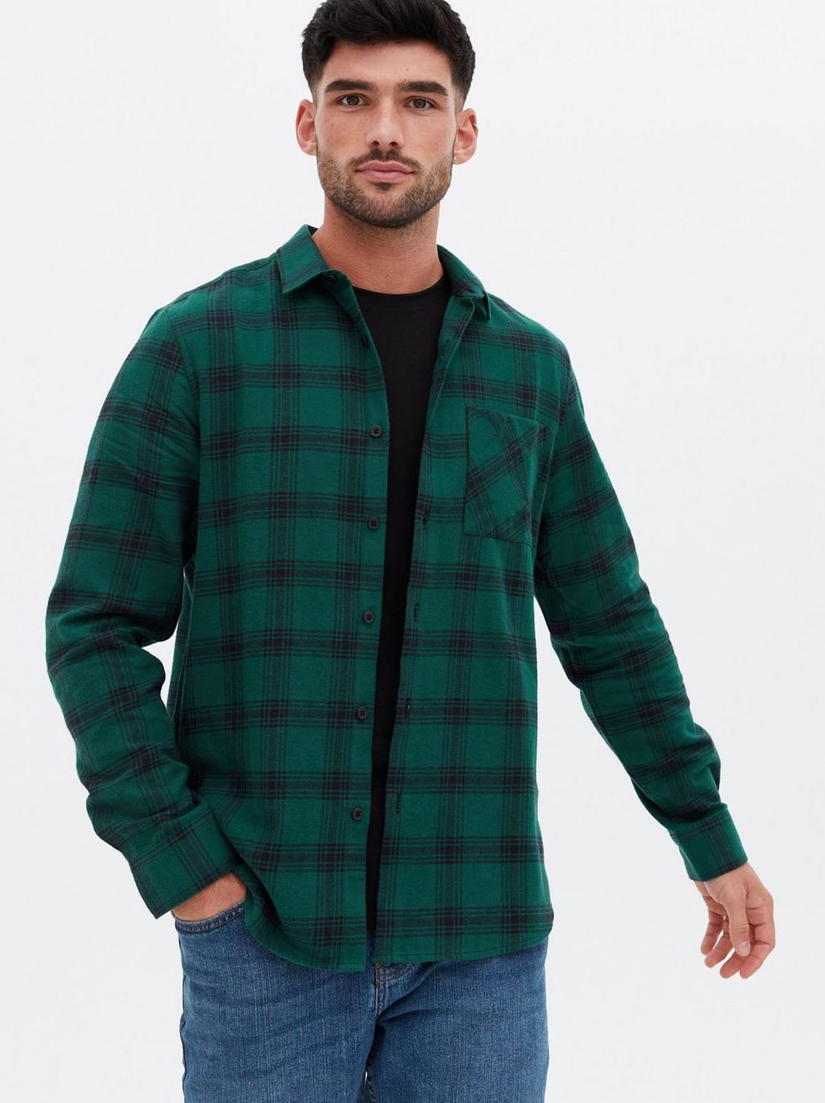 Man wearing a green check collared shirt
