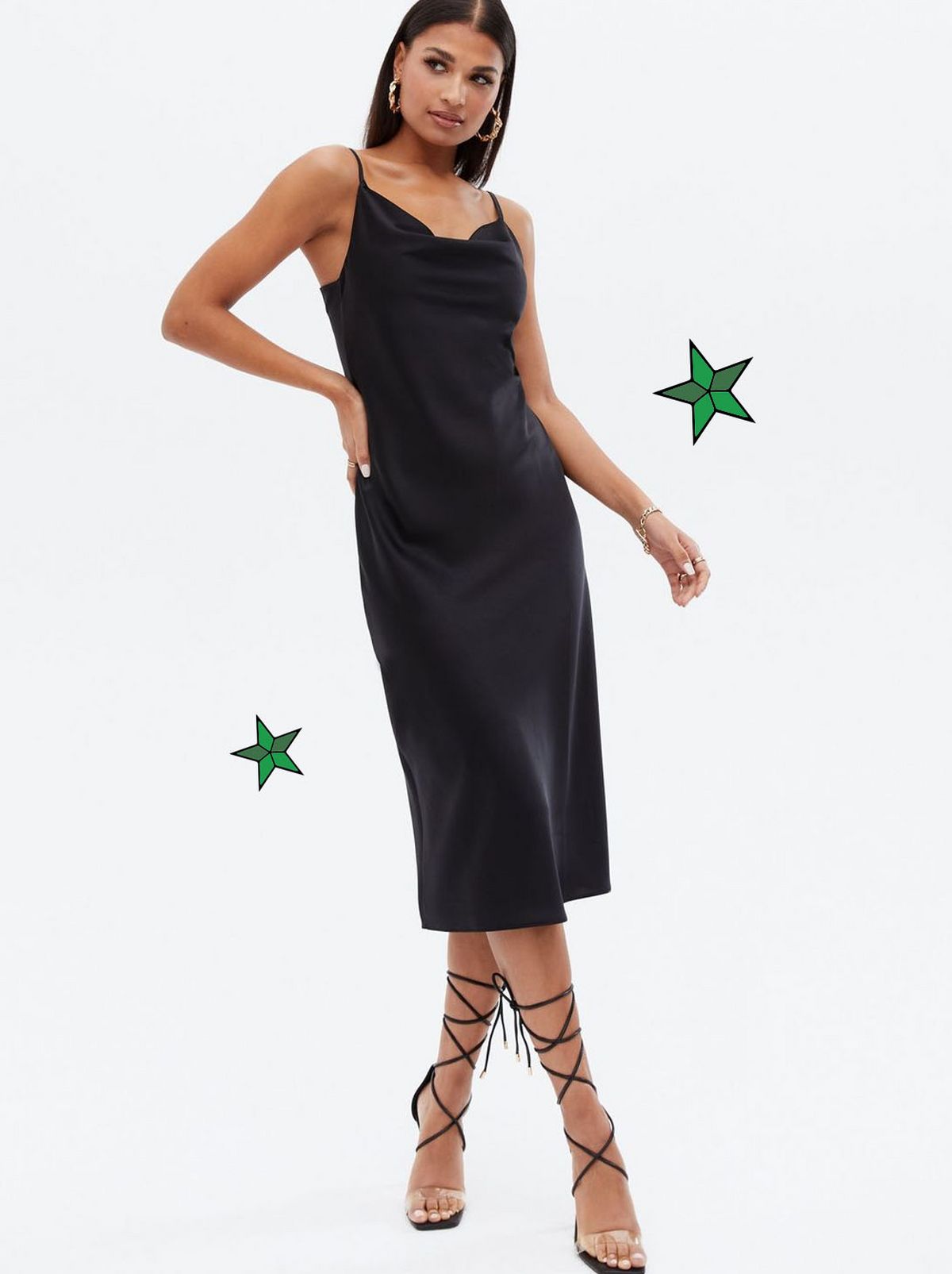 Woman wearing a black satin cowl midi dress	