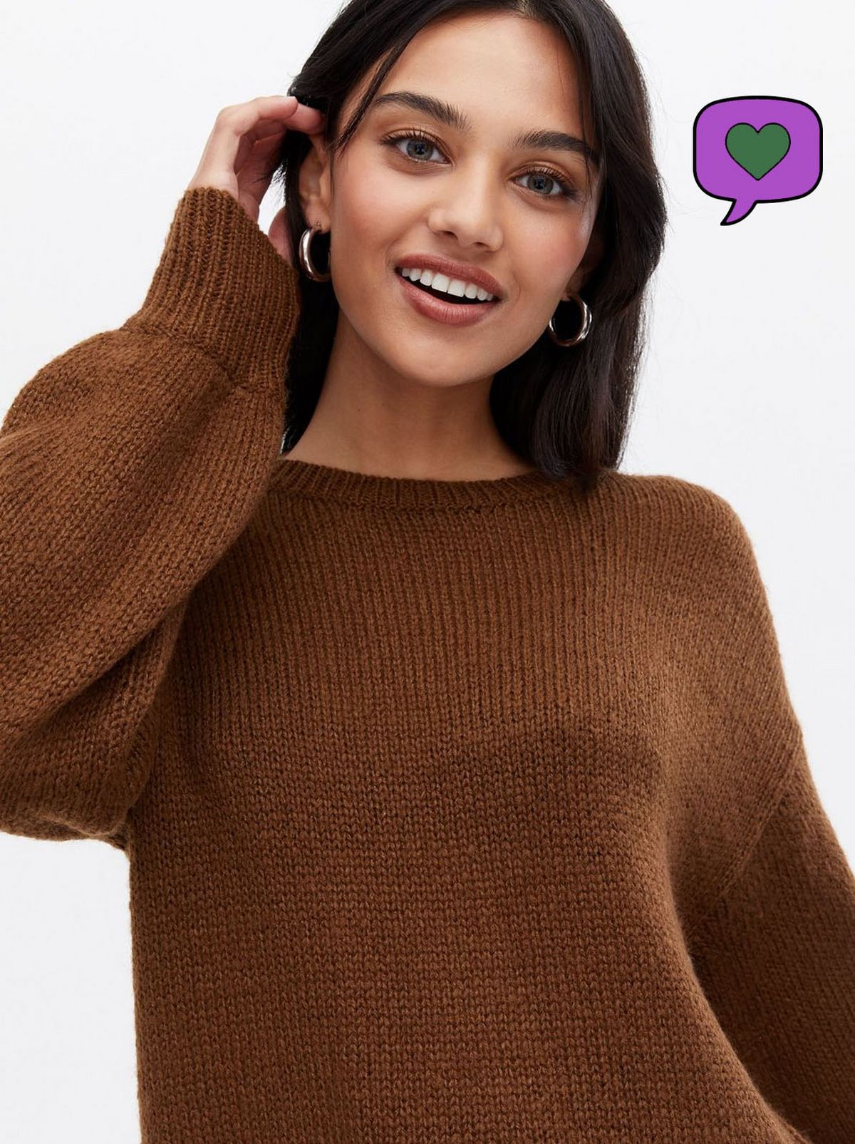 Woman wearing a rust crew neck jumper	