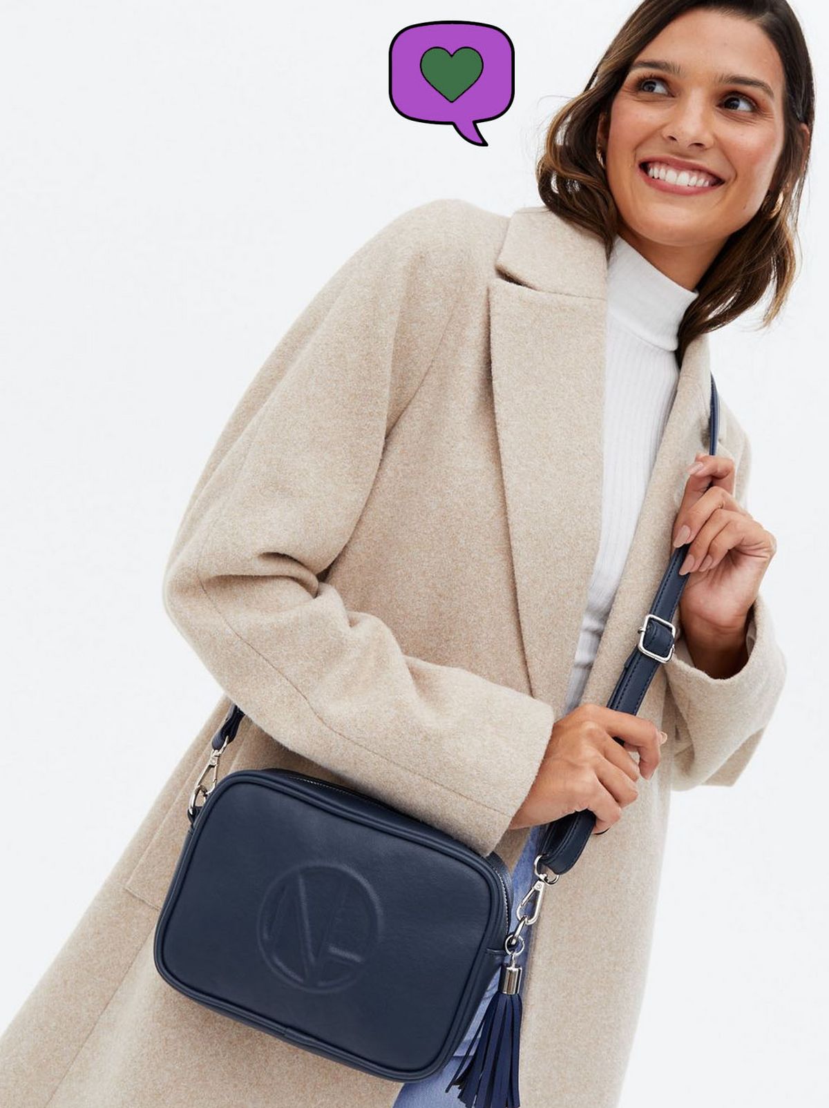 Woman wearing a navy leather crossed body bag	
