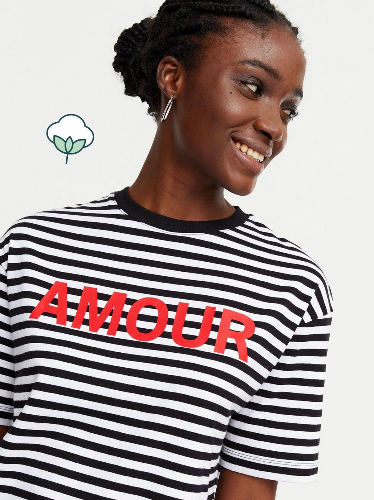 Woman wearing a white stripe amour logo t shirt