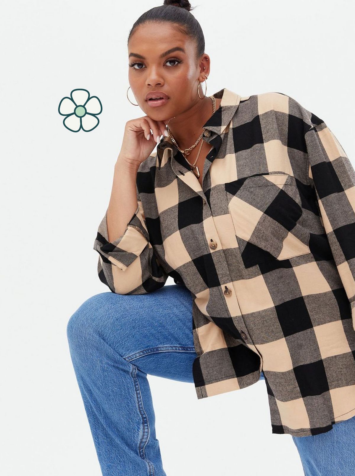Woman wearing a check oversized shirt