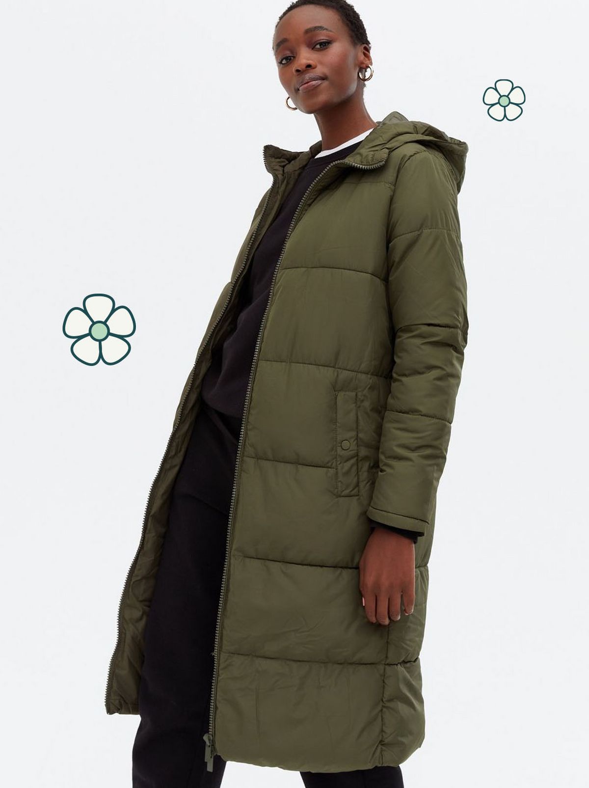 Woman wearing a long khaki hooded puffer coat 